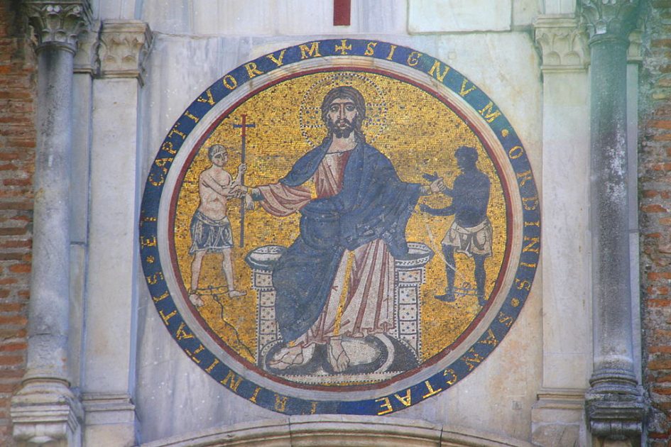 Mosaic depicting a seated Christ grasping the arms of two men wearing leg shackles.